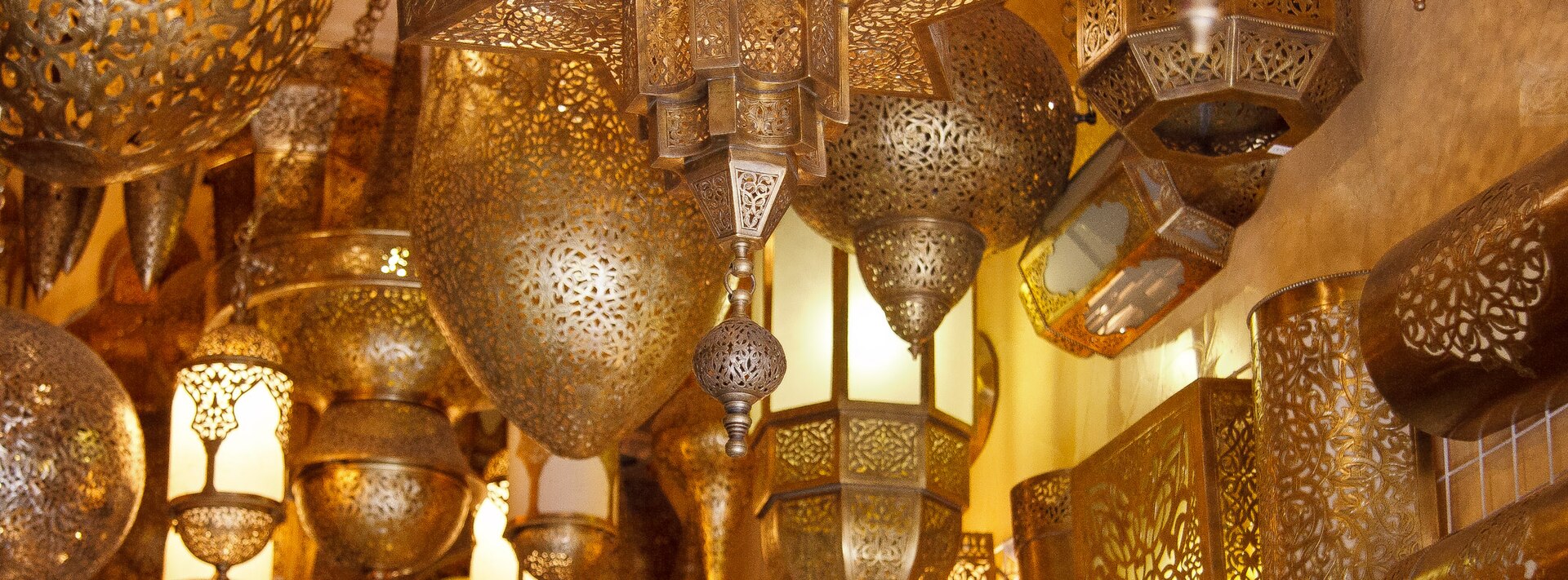Brass lanterns hanging in a Marrakech shop